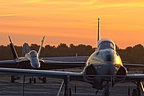 Acemaker's T-33 and Blue Angels' F/A-18C as the sun rises over William J. Fox Airport
