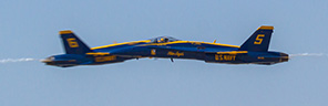 Blue Angels solos crossing in center