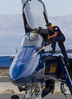 Blue Angels pilot adjusting his mask
