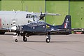 Shorts Tucano T.1, ZF374/374, from 1 Flying Training School taxies in with Belgian C-130H dropping off ground crew behind.