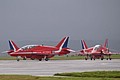 1100 hrs. Saturday and the sun breaks through the cloud for the arrival of the Royal Air Force Aerobatic Team - The Red Arrows - and their Hawk T.1.