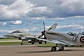 Display completed 11 Squadron Typhoon FGR.4 ZJ923/DM taxies back in past the 6 Squadron marked BBMF Spitfire awaiting engine start for his turn.