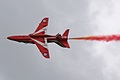 Red Arrows Hawk trailing smoke and maneuvering while inverted during the second, dynamic, section of the team's display