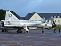 The natural metal finish of the Swedish Air Force Historic Flight's SAAB AJS 37 Viggen reflects the early morning sunlight after transiting to Leuchars