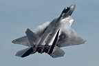 F-22 high angle climb for altitude producing vapor clouds