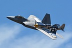 U.S. Air Force Heritage Flight of the F-22, being joined by the P-51D Mustang 'Bald Eagle'