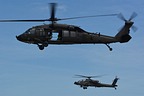 Rhode Island National Guard UH-60 escorted by AH-64 Apache