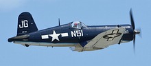 FG-1D Corsair dedicated to John H. Glenn, who flew a USMC Corsair coded N51, downed three MiG-15s in Korea flying USAF F-86 Sabre, and later became a Mercury astronaut and U.S. Senatord