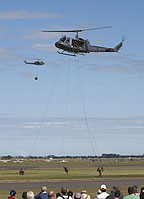Soldiers fast roping from the UH-1H