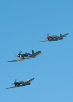 Corsair leading pair of P-40s