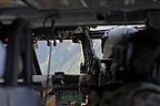 A view from inside the Pave Hawk while pilots are performing approach simulations to different peaks