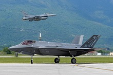 An Italian Air Force F-35A Lightning II assigned to the 3° Gruppo / 32° Stormo, Amendola Air Base, taxis while a 555th FS / 31st FW F-16 Fighting Falcon takes off during Astral Knight 2021 at Aviano Air Base, Italy, May 21, 2021. <br>(U.S. Air Force photo by Airman 1st Class Brooke Moeder)