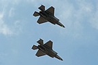 The pair of Aeronautica Militare F-35A Lightning IIs flies over Aviano AB before breaking formation for landing